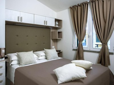 Cliquez pour découvrir toutes les photos de l'HÉBERGEMENT ! bungalow - Village Baia Azzurra photo 3
